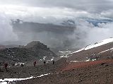 Ecuador Cotopaxi 02-06 Hiking To Refuge Almost There After an hour slip sliding in the sand and withstanding the wind and hail we are almost to the refuge.